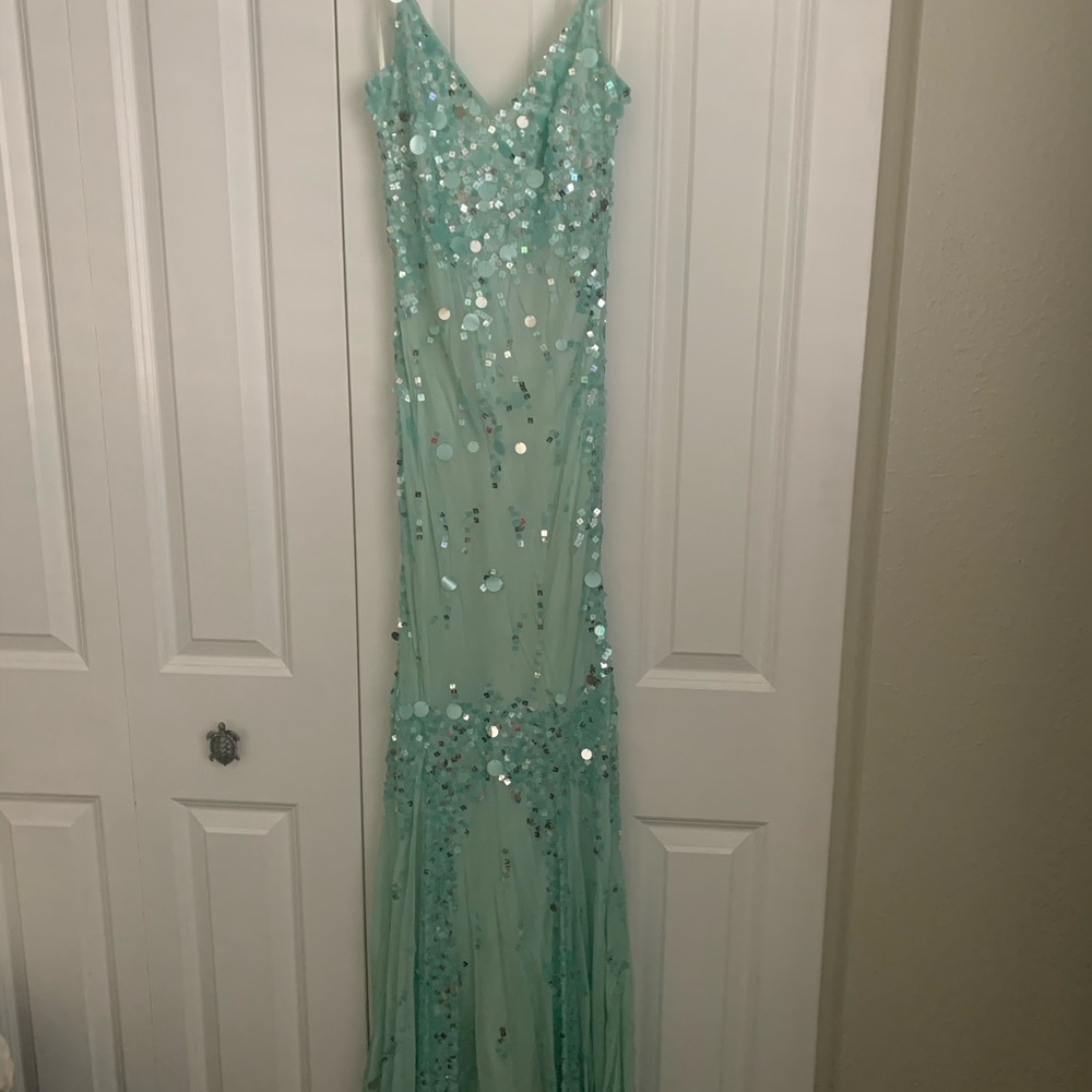 Beautiful boutique and one of a kind, teal sequined, slight mermaid bodice dress